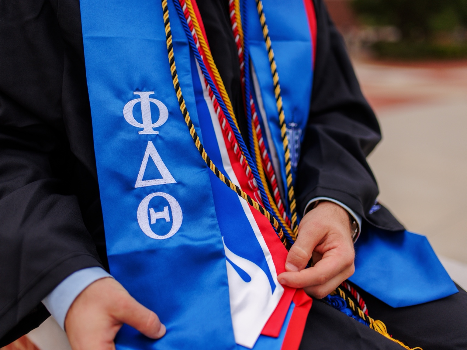 Colorful graduation stole and cords